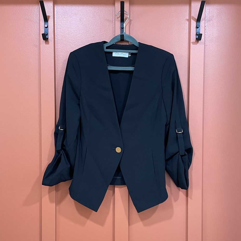 Black Calvin Klein blazer with gold accents
